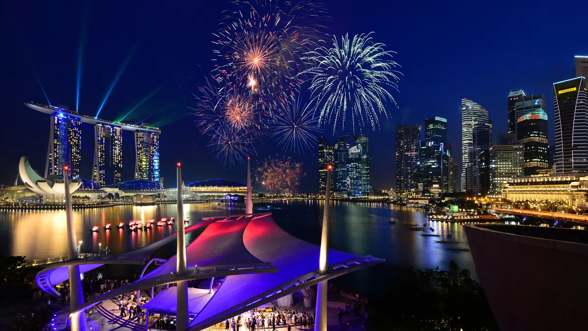 Marina Bay Sands — Fireworks over Marina Bay Sands and the CBD skyline, seen from the Event Plaza at the water's edge
