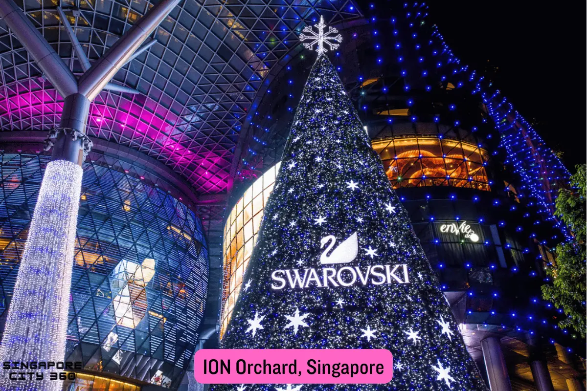 Orchard Road shopping belt in Singapore, with mall facades and shoppers along the tree-lined pavement