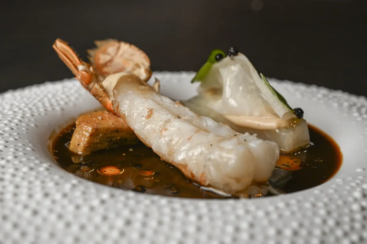 Langoustine over a dark broth with caviar at Lerouy, Singapore