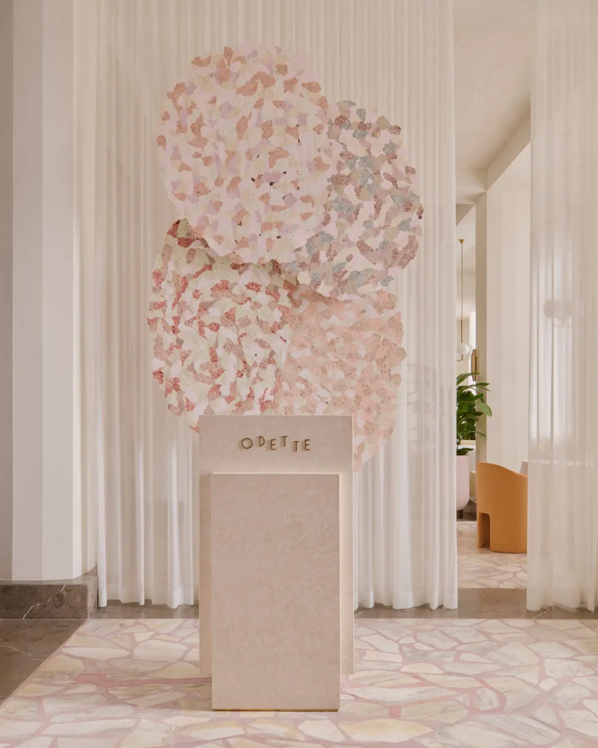 Odette dining room entrance with hanging blossom installation, National Gallery Singapore