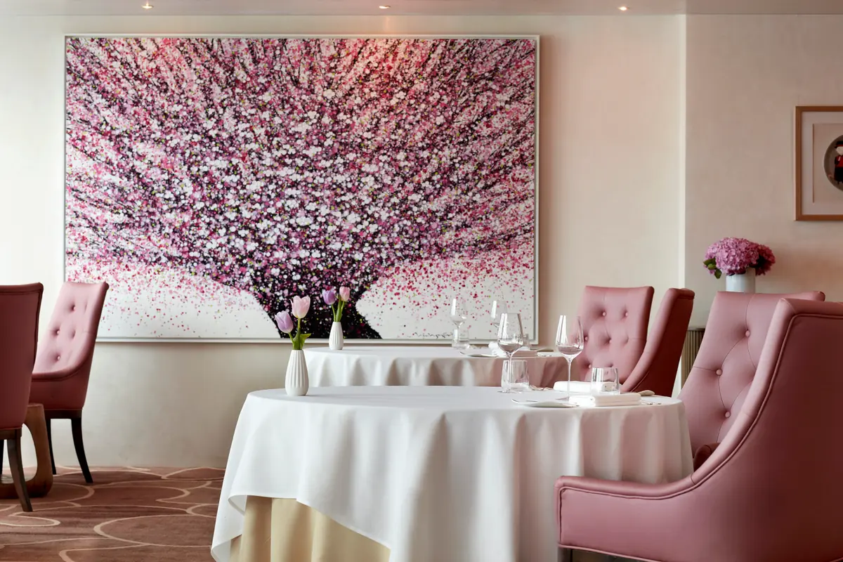 The Saint Pierre dining room with cherry-blossom artwork, One Fullerton, Singapore