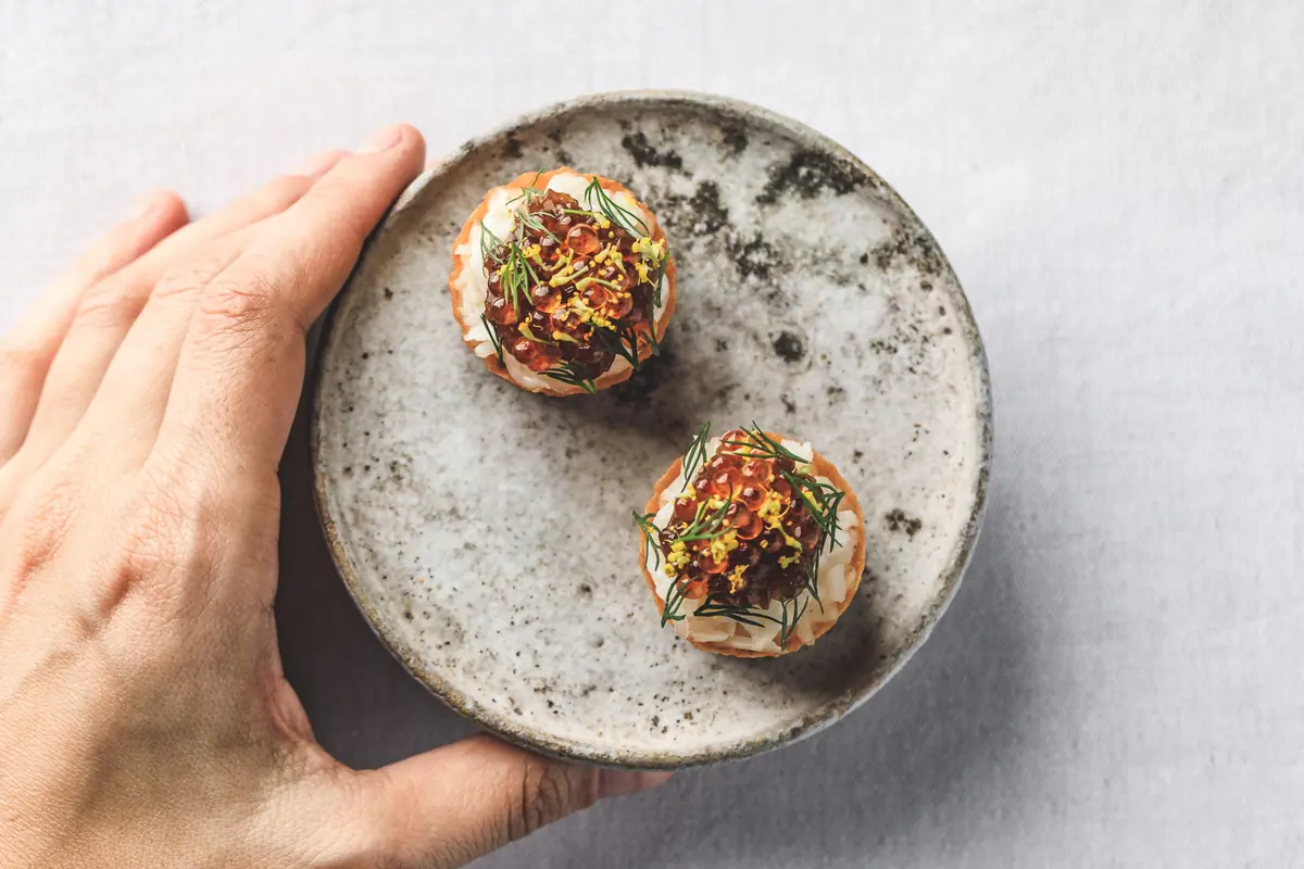 Signature seafood dish in a stone bowl at Zen, Singapore