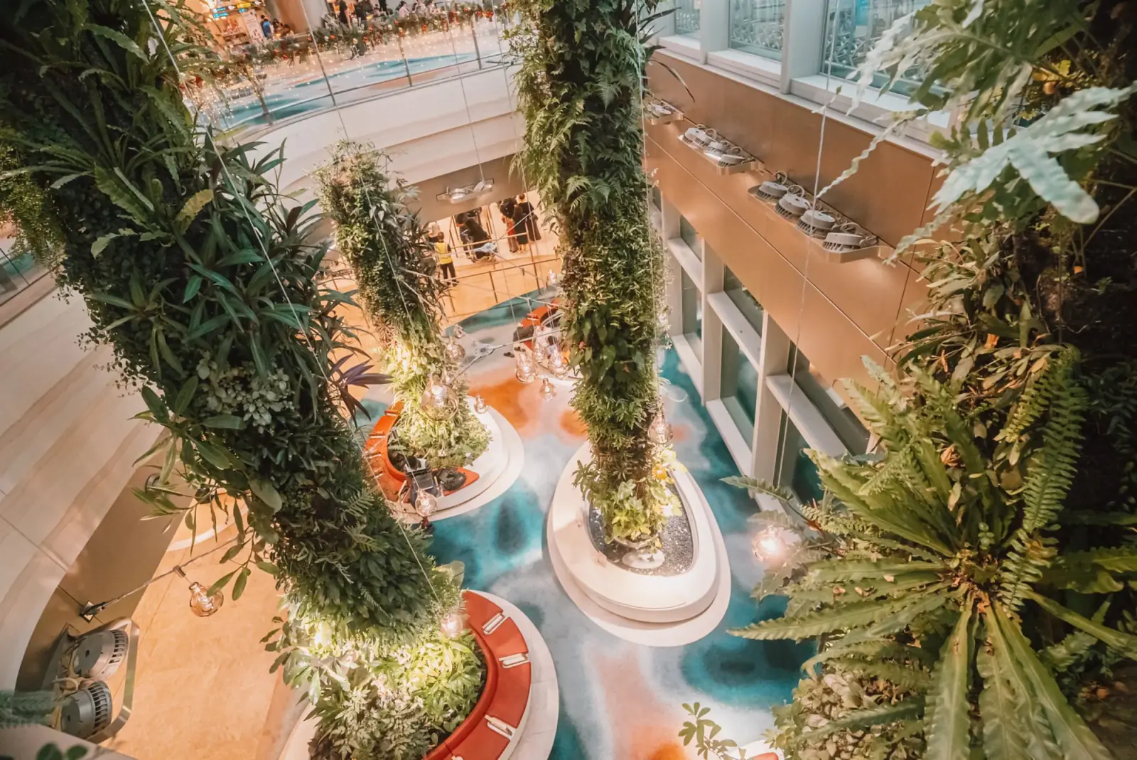 Changi Airport — Plant-covered green columns lining the walkway between the departure and arrival halls at Terminal 2, Changi Airport