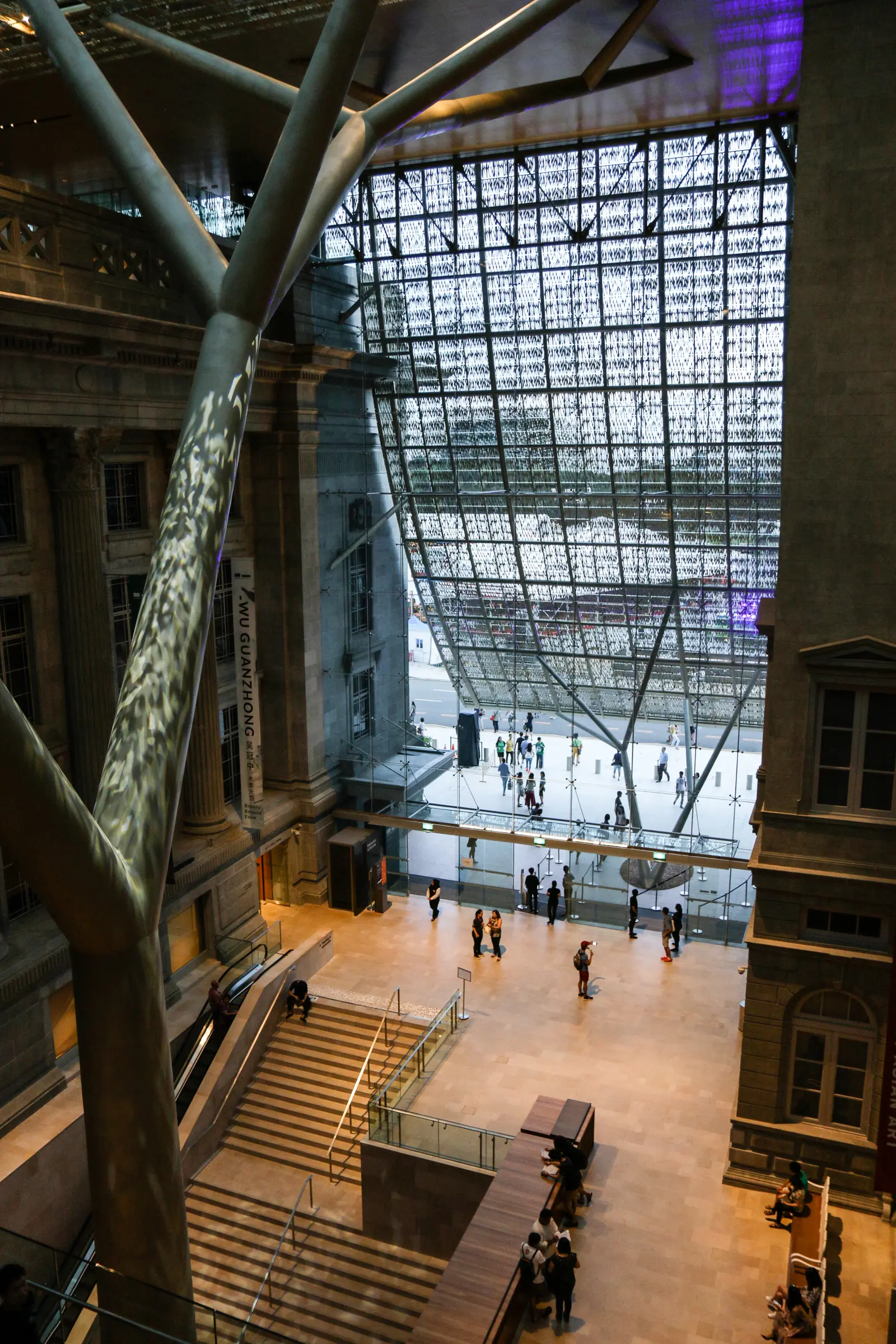 National Gallery Singapore — The Padang Atrium at National Gallery Singapore, a tall glass-roofed space overlooking the Padang