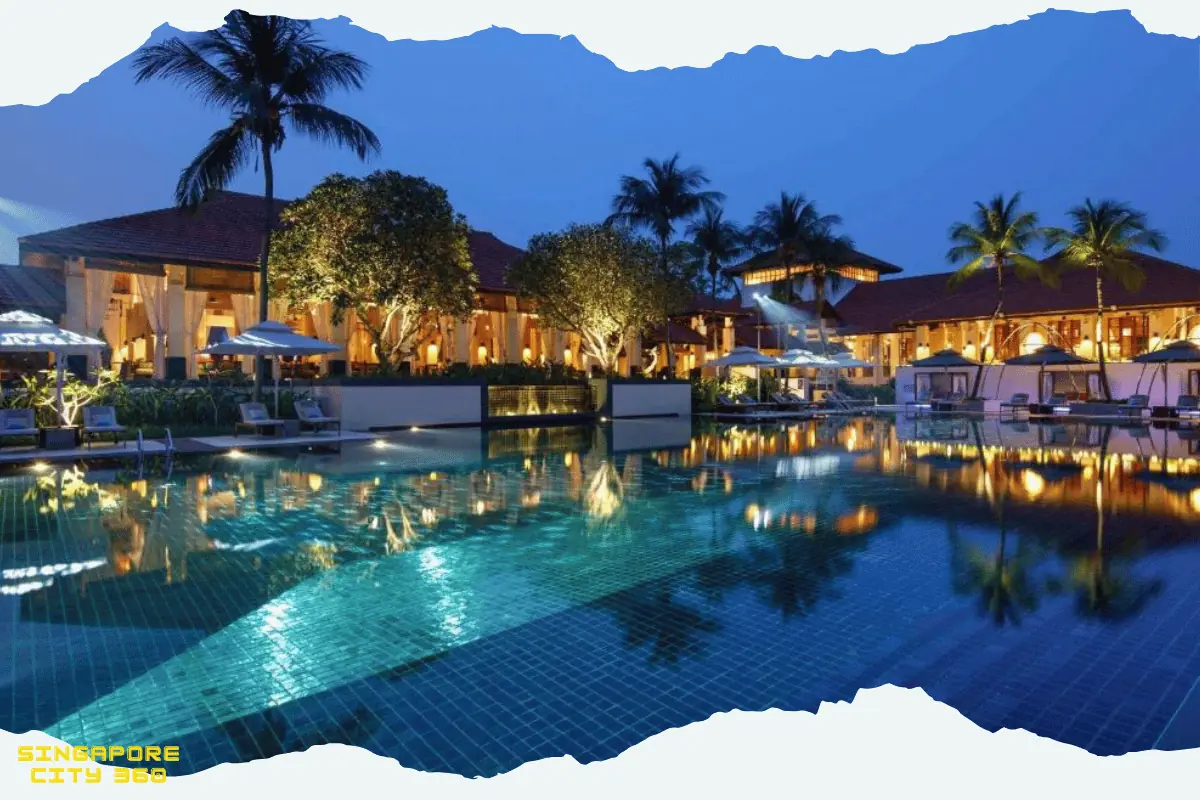 Sofitel Singapore Sentosa cliff-top grounds and the black-tiled 33-metre pool surrounded by palms