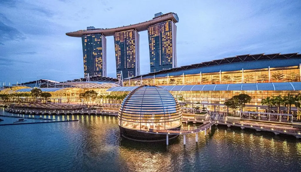 Guest room at Marina Bay Sands with a floor-to-ceiling window over Marina Bay